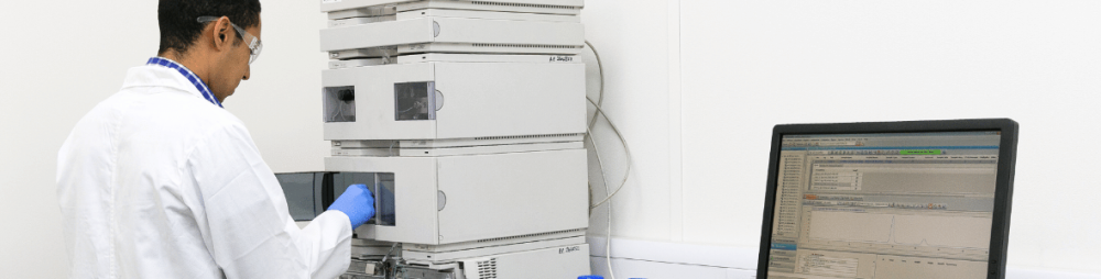 Hello Bio scientist operating HPLC system — part of our ISO-certified quality control process for reagent production